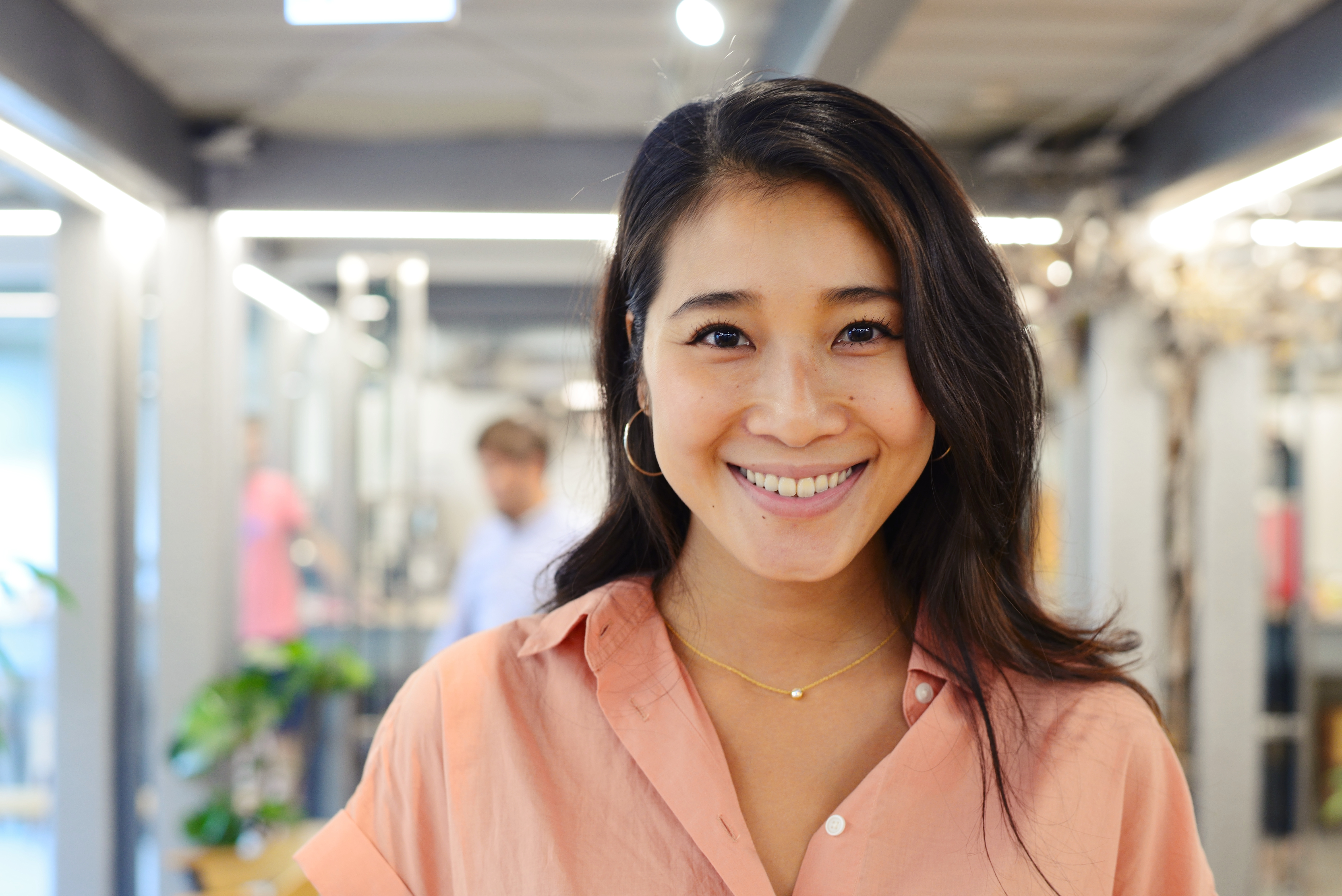 Asian woman has a black hair wearing Bink blouse, Young Asian woman looking forward.